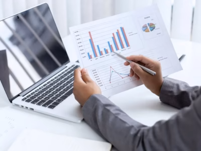 A professional analyzing growth charts and data for the internationalization of a company.