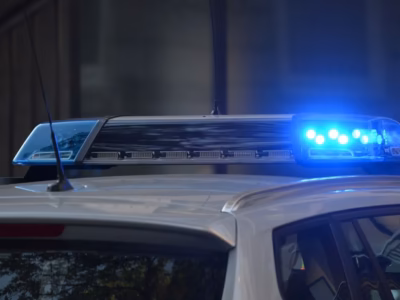 Blue lights of a police car. Urgent legal assistance for detainees.