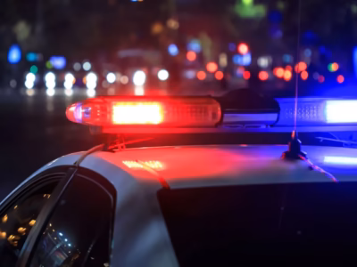 Red and blue police car lights. Learn about the new criminal and judicial investigation measures.