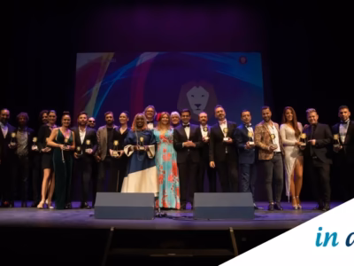 IN DIEM Abogados team and award winners on stage during the 2022 Latino Awards gala
