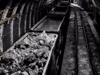 Freight wagons inside an old mine. Mining regulation and the historical factor. 